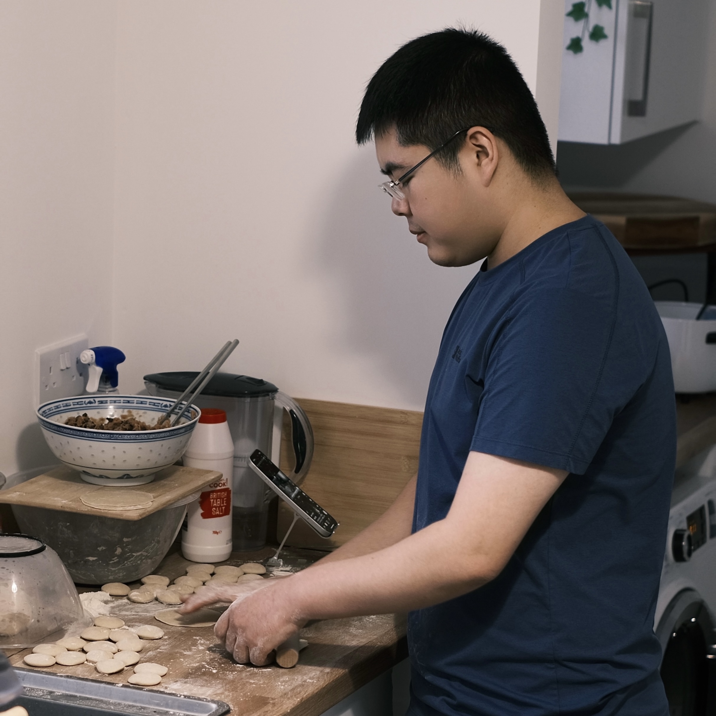 Xihao Zhang cooking and baking in a kitchen