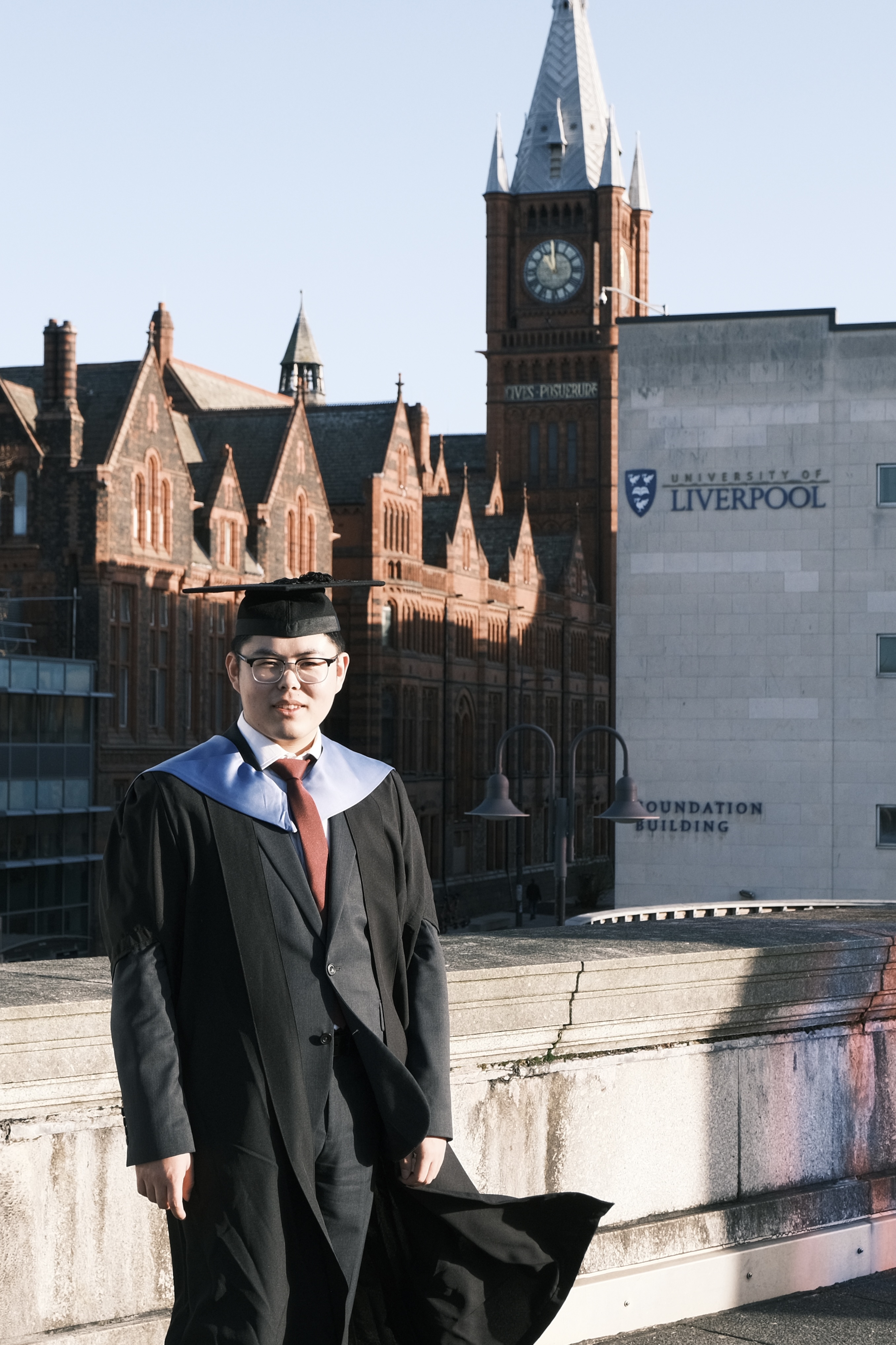 Xihao Zhang in graduation gown at the University of Liverpool